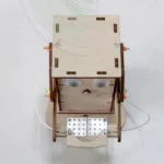 Robotic wooden maze with sensors and moving parts for STEM learning.