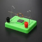 Educational electromagnetic induction kit with copper coil, magnets, and metal ring for science experiments and learning.