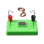 Green educational science kit with wires, magnets, and a metal plate for learning about electric circuits and magnetism.