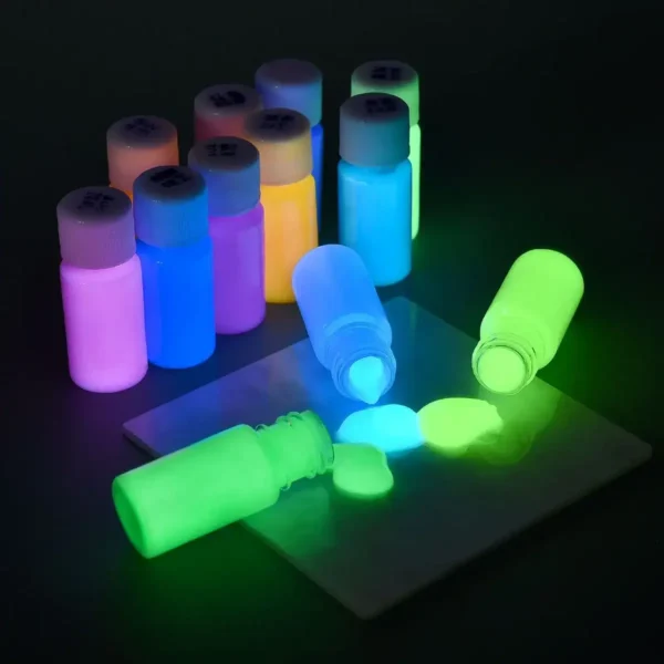 Glow-in-the-dark paint bottles with vibrant colors illuminated under UV light, perfect for educational science projects and creative decor.
