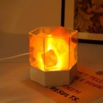 Illuminated rock lamp with glowing orange stones, perfect for science-themed decor and educational displays.