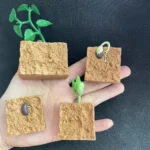 Set of four miniature plant growth models showing seed germination, root development, and plant sprouting, designed for educational purposes and science experiments.