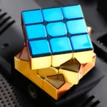 A magnetic Rubik's Cube puzzle with a shiny blue and gold finish, designed for educational and recreational use.