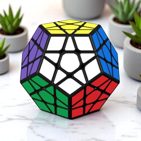 A colorful hexagonal Rubik's Cube puzzle with black frame, featuring white, yellow, blue, green, and red stickers, placed on a white marble surface with potted plants in the background.