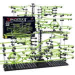 Innovative space-themed marble run with multiple green tracks and black support structure, perfect for educational play and STEM learning.