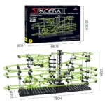 Educational marble run with glowing green tracks, black base, and mechanical components for science and engineering fun.