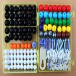 Colorful educational bead set with various sizes and shapes for science projects, learning activities, and STEM experiments. Perfect for classroom and home science decor.