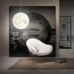 Elegant moon-shaped pendant light hanging in a contemporary living space, creating a calming ambiance with its soft glow. Perfect for modern interior decoration and adding a celestial touch.