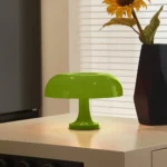 Green mushroom-shaped LED lamp for modern home decor and educational purposes.