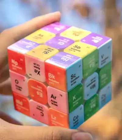 Vibrant 3D periodic table cube featuring chemical element blocks for learning and decoration.