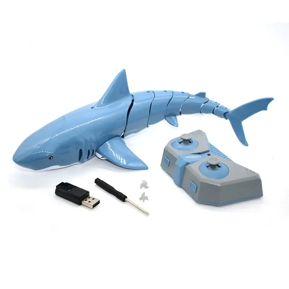 Shark RC Toy with Remote Control and USB Charger Remote-controlled shark toy with USB charging, includes a USB receiver, remote control, and small accessories. Perfect for educational play and science demonstrations.