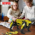 Two children assembling a yellow robotic dog toy with 921 pieces, educational STEM activity for kids, fun science gadget.