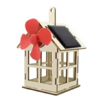 Wooden solar-powered windmill model with pink blades, designed for educational and decorative purposes, showcasing renewable energy concepts.