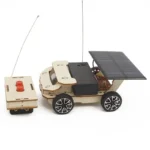 Wooden robot car with solar panel, remote control, and electronic components, showcasing a DIY educational robotics kit.