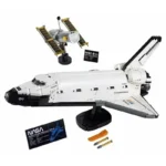 Detailed LEGO-style model of a NASA space shuttle with satellite, batteries, and informational cards, ideal for science education and space-themed decor.