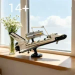 Detailed LEGO-style space shuttle model displayed on a windowsill with a vase of white flowers, showcasing a realistic design perfect for science and space lovers.