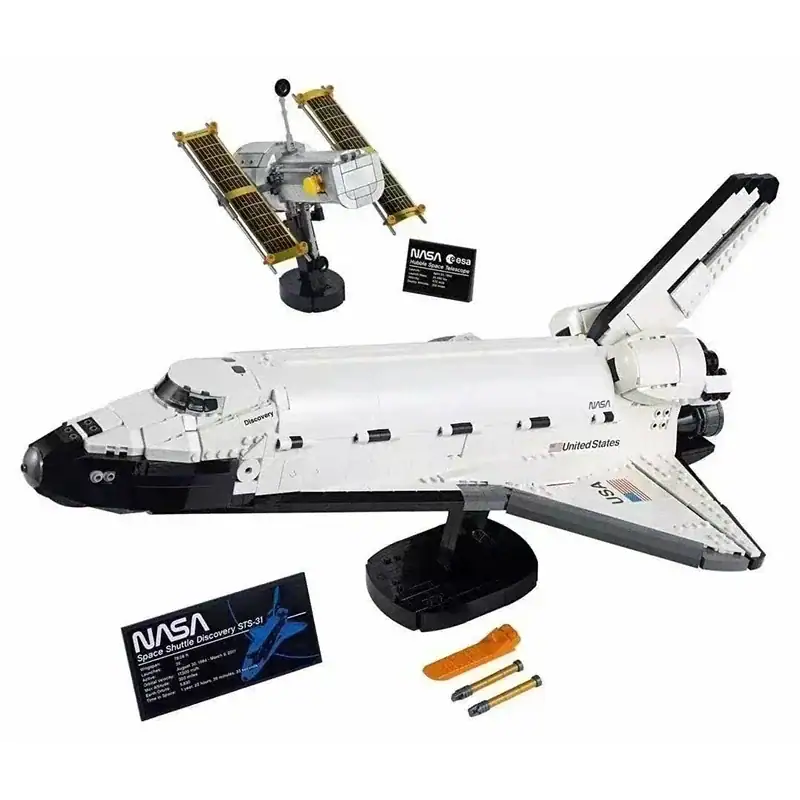 Detailed LEGO-style model of a NASA space shuttle with satellite, batteries, and informational cards, ideal for science education and space-themed decor.