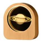 Saturn planet lamp with illuminated rings, made of wood, perfect for science decor and educational spaces.