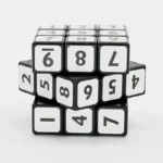 Cube-shaped puzzle with numbered sides for educational and recreational use.