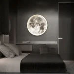 Realistic moon-shaped night light mounted on a dark wall, creating a cozy and celestial ambiance in a modern bedroom setting.