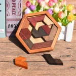 Wooden hexagon puzzle with interlocking geometric pieces in natural and stained wood finishes, designed for educational and brain-teasing fun.