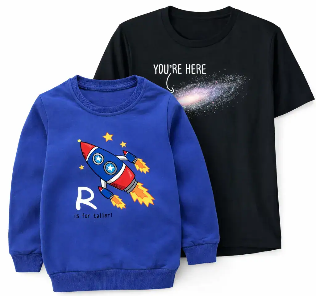 Bright blue children's sweatshirt featuring a colorful rocket ship with the letter "R" and the phrase "is for taller!" on the front. Behind, a black T-shirt displays a galaxy with the text "YOU'RE HER.