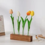 A decorative set of four colorful tulip flowers made from educational science materials, arranged in a wooden base, perfect for science-themed decor or educational displays.