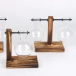 Glass chemistry flasks with wooden stands for science experiments and decor.
