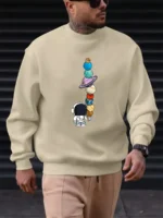 Sweatshirt avec illustration de planètes et astronautes, parfait pour les amateurs de science et d'astronomie. Confortable et tendance, idéal pour un look décontracté inspiré de l'univers.