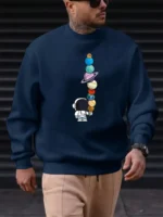 Casual navy sweatshirt featuring a graphic of an astronaut with a stack of colorful planets and celestial objects, perfect for science and space enthusiasts.