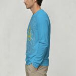 Bright blue long-sleeve shirt with scientific illustrations and a lightbulb graphic on the front.