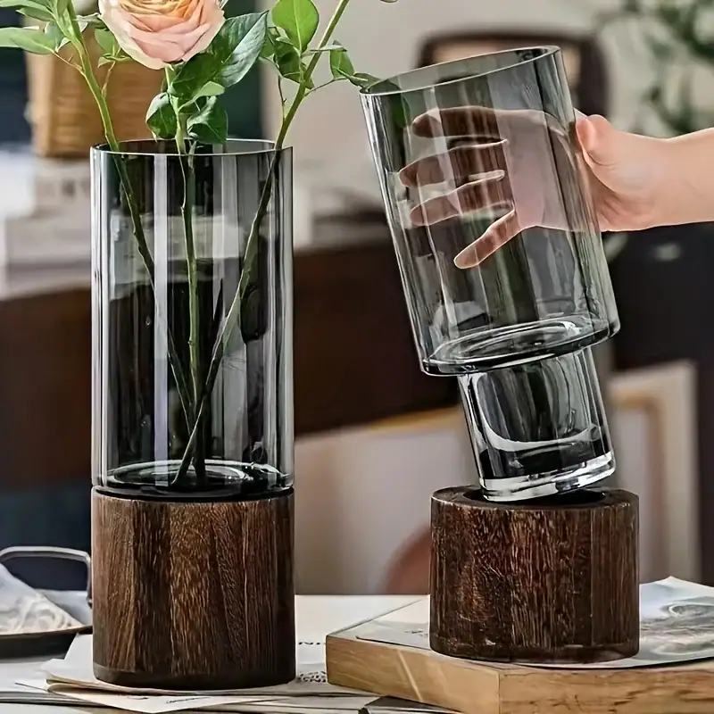 Modern glass vase with a wooden base, perfect for floral arrangements and home decoration.