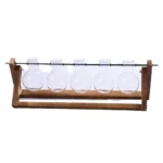 Laboratory glassware set with five round-bottom flasks on a wooden stand.