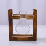 Clear glass Erlenmeyer flask held by a wooden stand, ideal for science experiments and educational demonstrations.