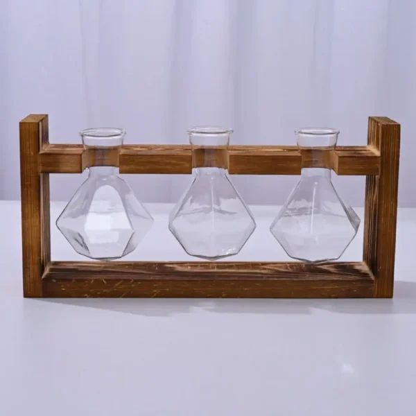 Laboratory glassware with three flasks in a wooden stand for science experiments.