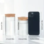 Versatile glass jars with cork lids for kitchen storage or decorative use. Compact size, perfect for organizing spices, herbs, or small items with a modern aesthetic.