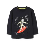 Children's black long-sleeve T-shirt featuring a fun astronaut surfing on a red board in space with planets and stars background. Perfect for young science and space enthusiasts.