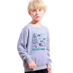 Child wearing a space-themed sweater with rocket and planets design, perfect for science and educational decor.