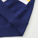 Blue sweatshirt with a close-up of the sleeve cuff.