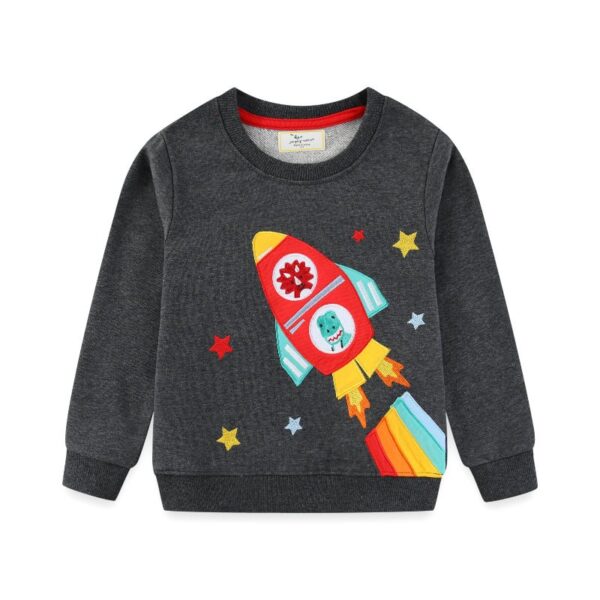 A playful children's sweater featuring a colorful rocket ship design with stars, perfect for science-themed decor and educational toys.