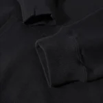 Black sweatshirt with ribbed cuffs and collar, close-up view.