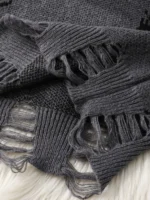 Warm gray wool scarf with fringed edges, perfect for cold weather.