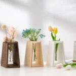 Set of three small decorative flower vases in different colors and materials, perfect for home decor or educational science projects.