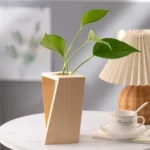 Eco-friendly wooden plant vase with a geometric design, perfect for indoor decoration and adding a touch of nature to your living space.