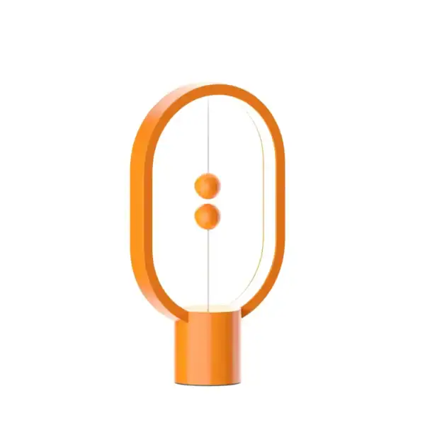 Innovative magnetic levitation science toy demonstrating magnetic repulsion with two orange spheres floating inside an oval frame. Perfect for educational science displays and STEM learning.